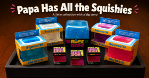 Papa Has All the Squishies — a collection of colorful Squeez'M and NeeDoh squishy cubes displayed on a wooden tray